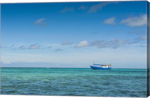 Framed Fishing boat in the turquoise waters of the blue lagoon, Yasawa, Fiji, South Pacific Print