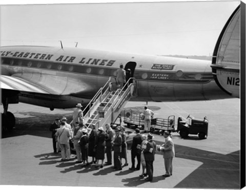 Framed 1950s Group Of Passengers Boarding Airplane Print