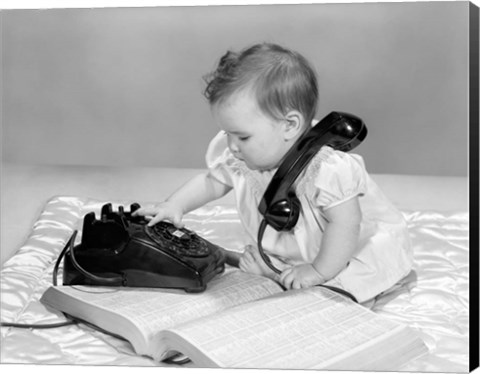 Framed 1960s Baby Girl With Telephone Book Print