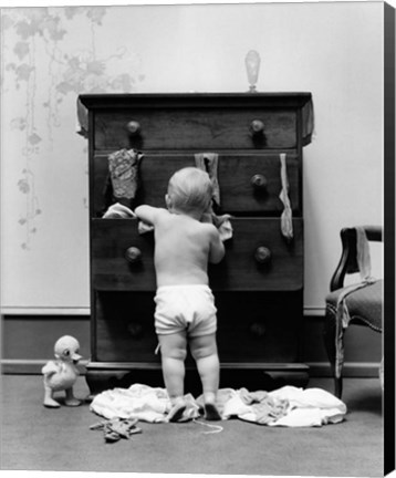 Framed 1940s Toddler Baby Pulling Clothes Out Of Bureau Print