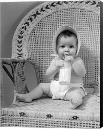 Framed 1940s Baby Sitting In Wicker Chair Print