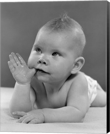 Framed 1950s Baby Lying On Stomach With Thumb In Mouth Print