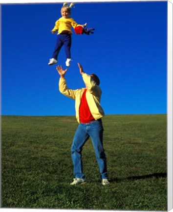 Framed 1990S Father Tossing Daughter Up In The Air Print