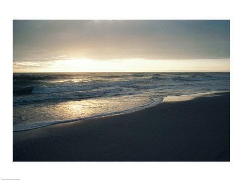 Framed Waves breaking on the beach at sunrise Print