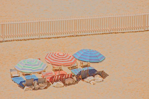 Framed Row of Umbrellas on Beach Print