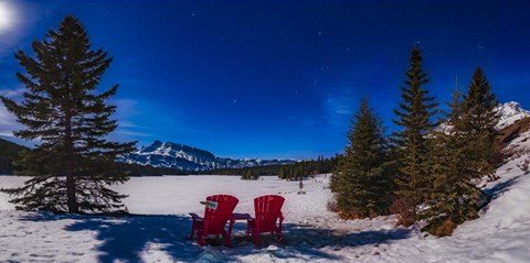 Framed Red Chairs Under a Moonlit Winter Sky at Two Jack Lake Print
