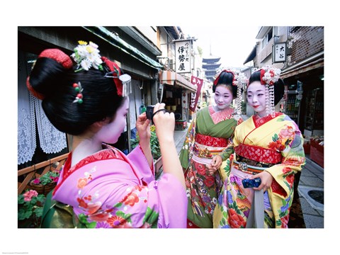 Framed Three geishas, Kyoto, Honshu, Japan (taking pictures) Print