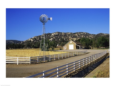 Framed Industrial windmill on a farm, California, USA Print