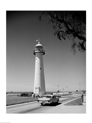 Framed USA, Mississippi, Biloxi, Biloxi Lighthouse with street in the foreground Print