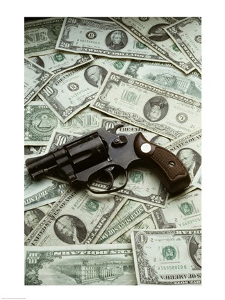 Framed Close-up of a handgun with paper currency Print