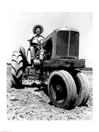 Framed Farmer Sitting on a Tractor in a Field Print