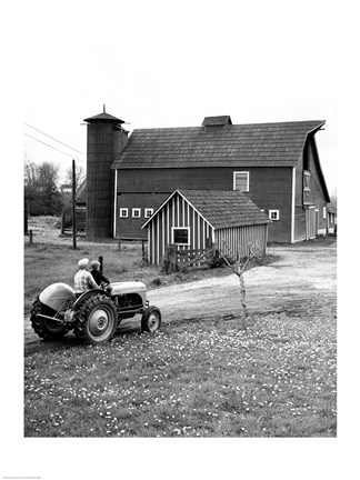 Framed Man with a Boy Riding a Tractor in a Field Print
