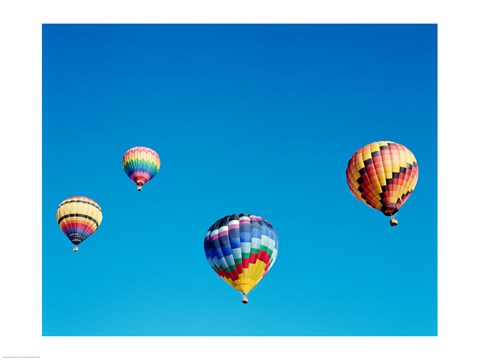 Framed 4 Rainbow Hot Air Balloons in the Bright Blue Sky Print