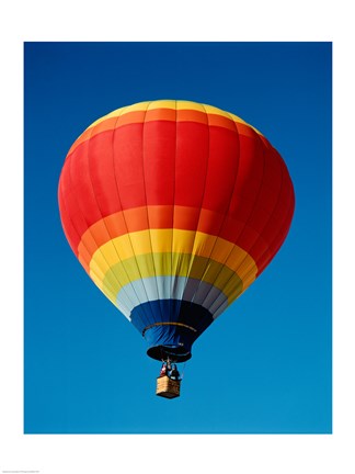 Framed Low angle view of a hot air balloon in the sky, New Mexico, Rainbow Print
