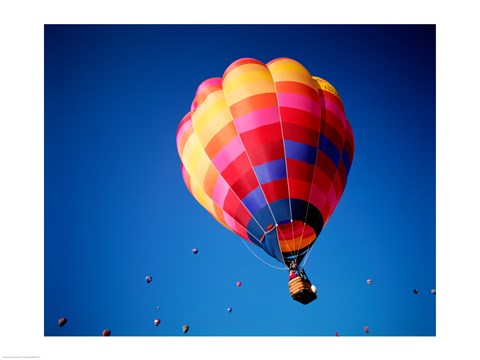 Framed Lone Hot Air Balloon with Other Hot Air Balloons in the Distance Print