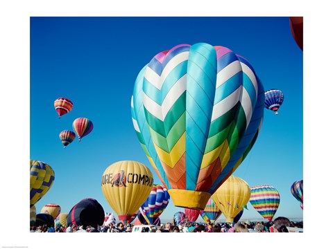 Framed Low angle view of hot air balloons taking off, Albuquerque International Balloon Fiesta, Albuquerque, New Mexico, USA Print