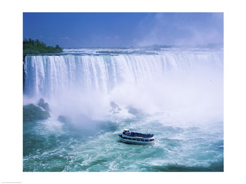 Framed High angle view of a tourboat in front of a waterfall, Niagara Falls, Ontario, Canada Print