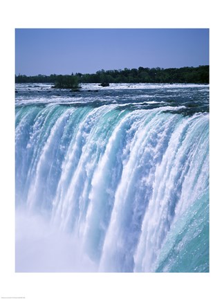 Framed Water flowing over Niagara Falls, Ontario, Canada Print