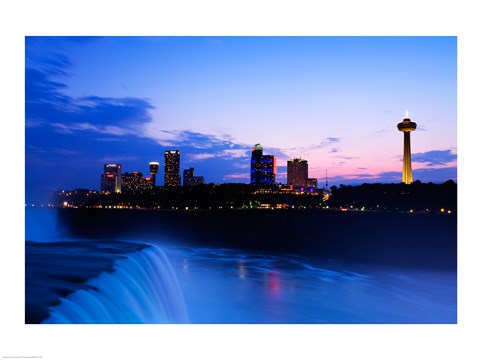 Framed Waterfall with buildings lit up at dusk, American Falls, Niagara Falls, City of Niagara Falls, New York State, USA Print