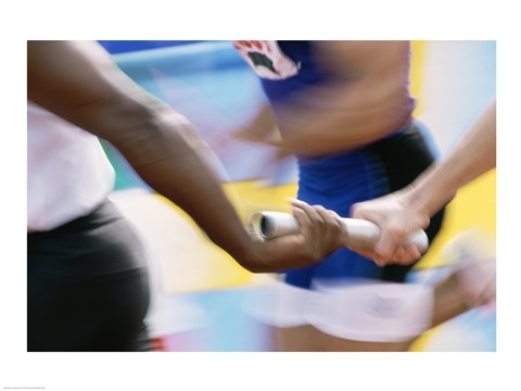 Framed Mid section view of runners exchanging baton at a relay race Print