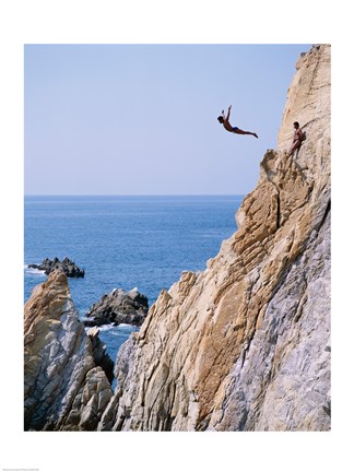 Framed Male cliff diver jumping off a cliff, La Quebrada, Acapulco, Mexico Print