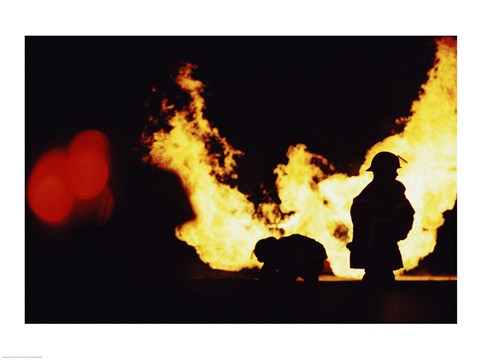 Framed Firefighters In front Of Flames Extinguishing A Fire Print