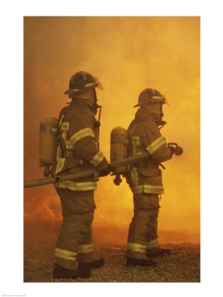 Framed Rear view of two firefighters extinguishing a fire Print