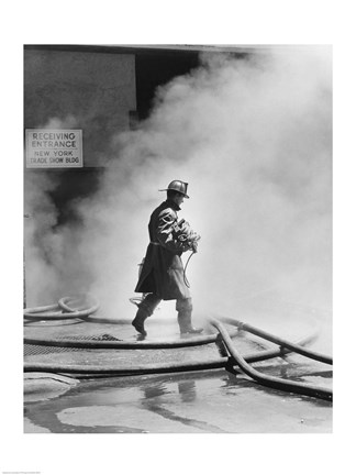 Framed Firefighter walking in front of smoke Print