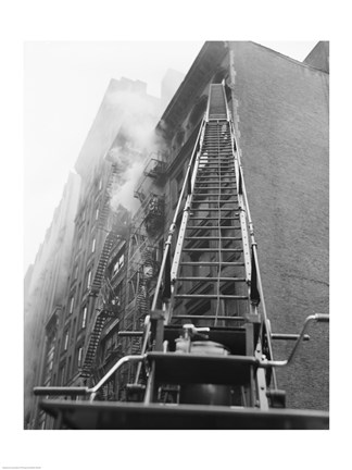 Framed Fire engine with ladder up burning building Print