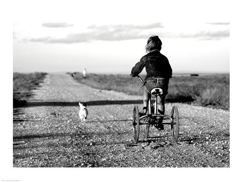 Framed Rear view of a girl riding a bicycle Print