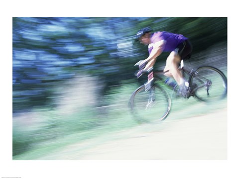 Framed Side profile of a young man riding a bicycle Print