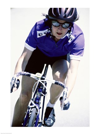 Framed Young woman riding a bicycle Print