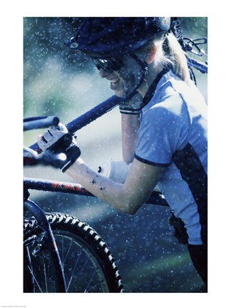 Framed Young woman carrying a bicycle on her shoulders Print