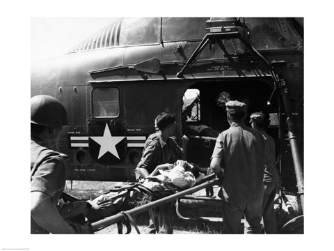 Framed Army soldiers carrying an injured person in a helicopter Print