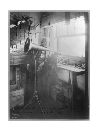 Framed Thomas Alva Edison, full-length portrait, standing, facing right, listening to a new record Print