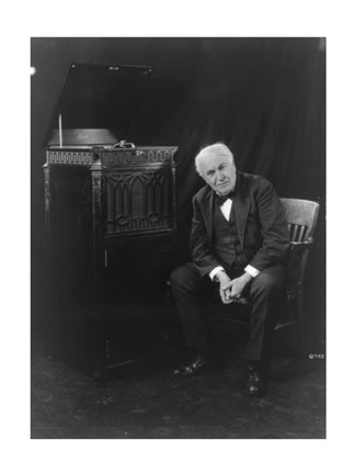 Framed Thomas Edison, seated beside phonograph Print