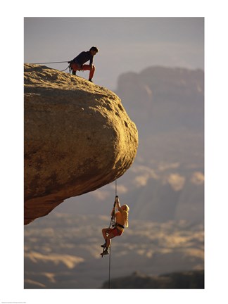 Framed View of rock climbers on the edge of a cliff Print