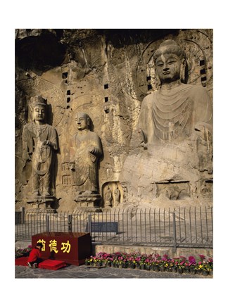 Framed Buddha Statue in a Cave, Longmen Caves, Luoyang, China with Flowers Print