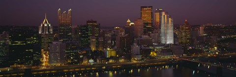 Framed High angle view of buildings lit up at night, Pittsburgh, Pennsylvania, USA Print