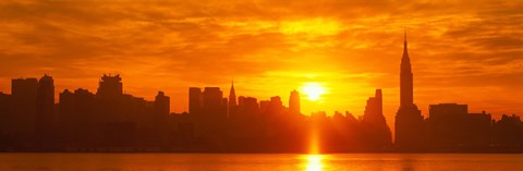 Framed Birght Orange Sky and Sun Behind the New York City Skyline Print