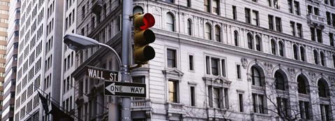 Framed Low angle view of a Red traffic light in front of a building, Wall Street, New York City Print