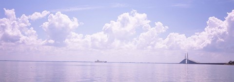 Framed Sea with a container ship and a suspension bridge in distant, Sunshine Skyway Bridge, Tampa Bay, Gulf of Mexico, Florida, USA Print