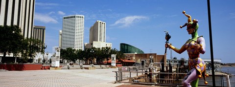 Framed Jester statue with buildings in the background, Riverwalk Area, New Orleans, Louisiana, USA Print