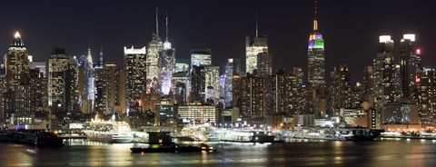 Framed Buildings in a city lit up at night, Hudson River, Midtown Manhattan, Manhattan, New York City, New York State, USA Print