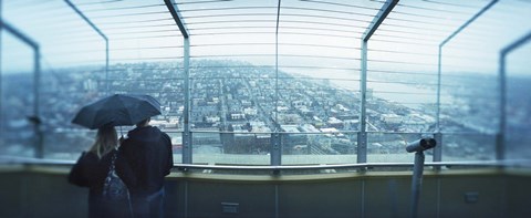 Framed Couple viewing a city from the Space Needle, Queen Anne Hill, Seattle, Washington State, USA Print