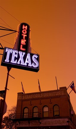 Framed Low angle view of a neon sign of a hotel lit up at dusk, Fort Worth Stockyards, Fort Worth, Texas, USA Print