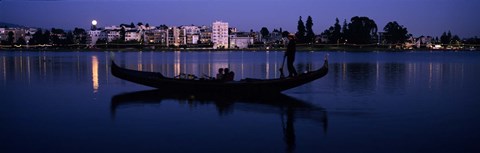 Framed Boat in a lake with city in the background, Lake Merritt, Oakland, Alameda County, California, USA Print