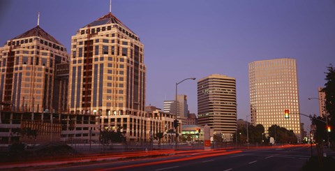 Framed USA, California, Oakland, Alameda County, New City Center, Buildings lit up at night Print