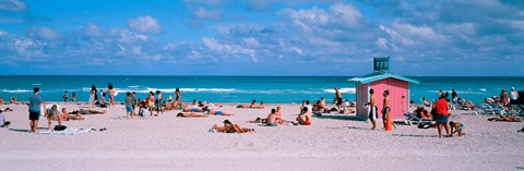 Framed Tourist on the beach, Miami, Florida, USA Print