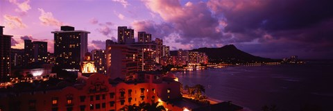 Framed Buildings lit up at dusk, Waikiki, Oahu, Hawaii, USA Print